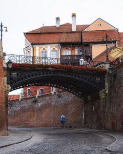 a bridge with a building in the background