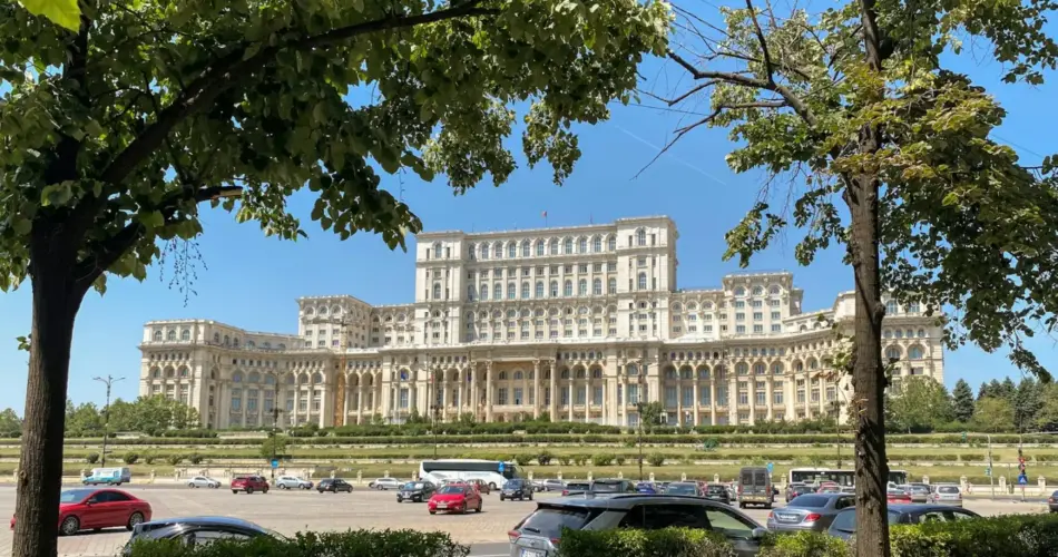 How to get from Bucharest to Constanta 1 a large building with a lot of cars parked in front of it