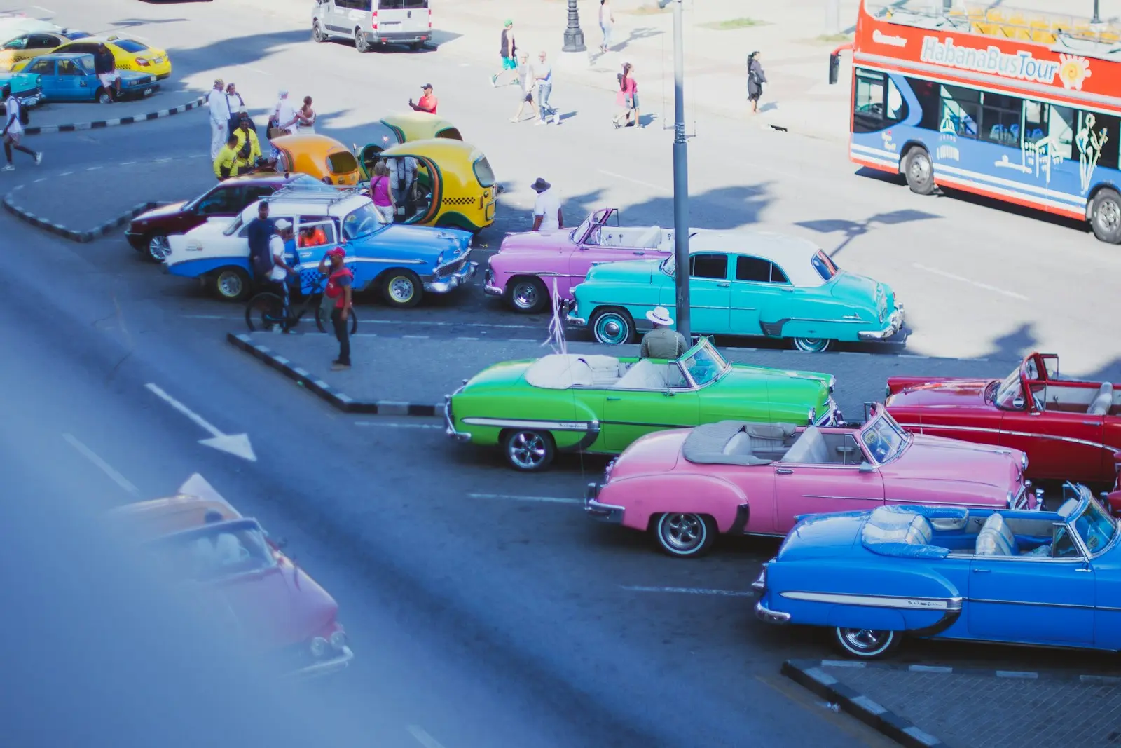Photo by Monique Caraballo A group of cars parked next to each other in a parking lot