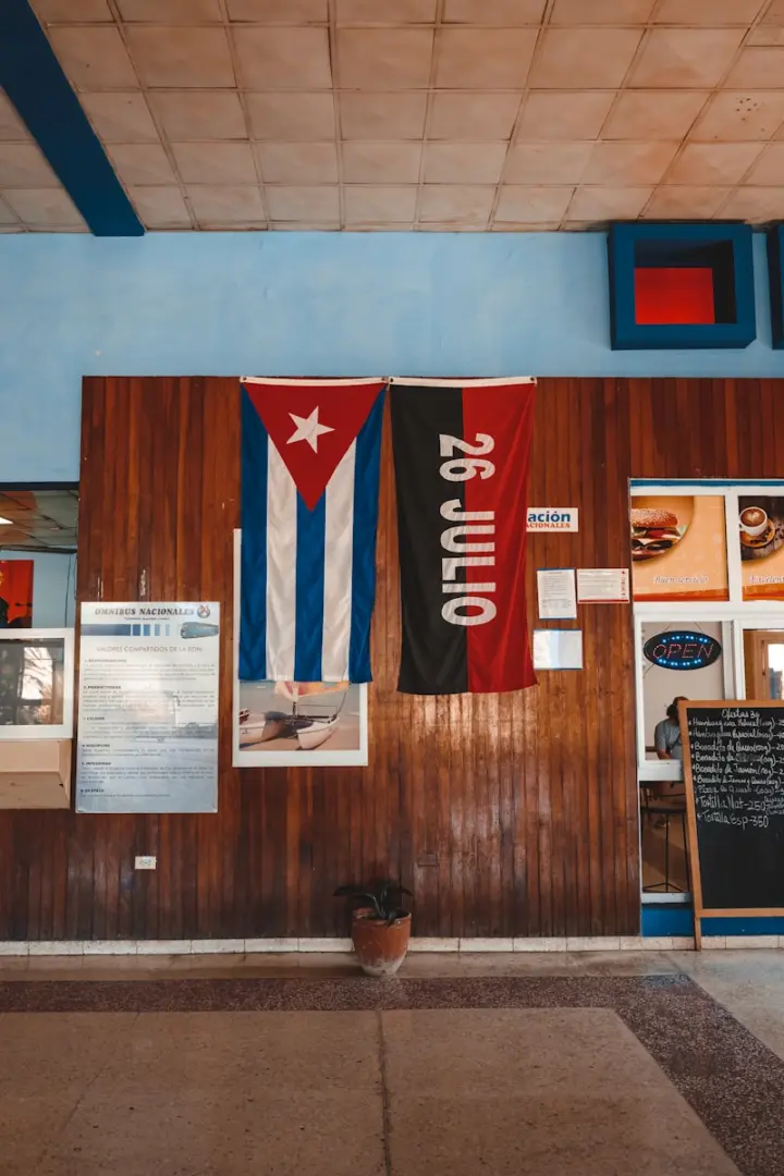 Photo by Mauro Lima a restaurant with flags hanging on the wall