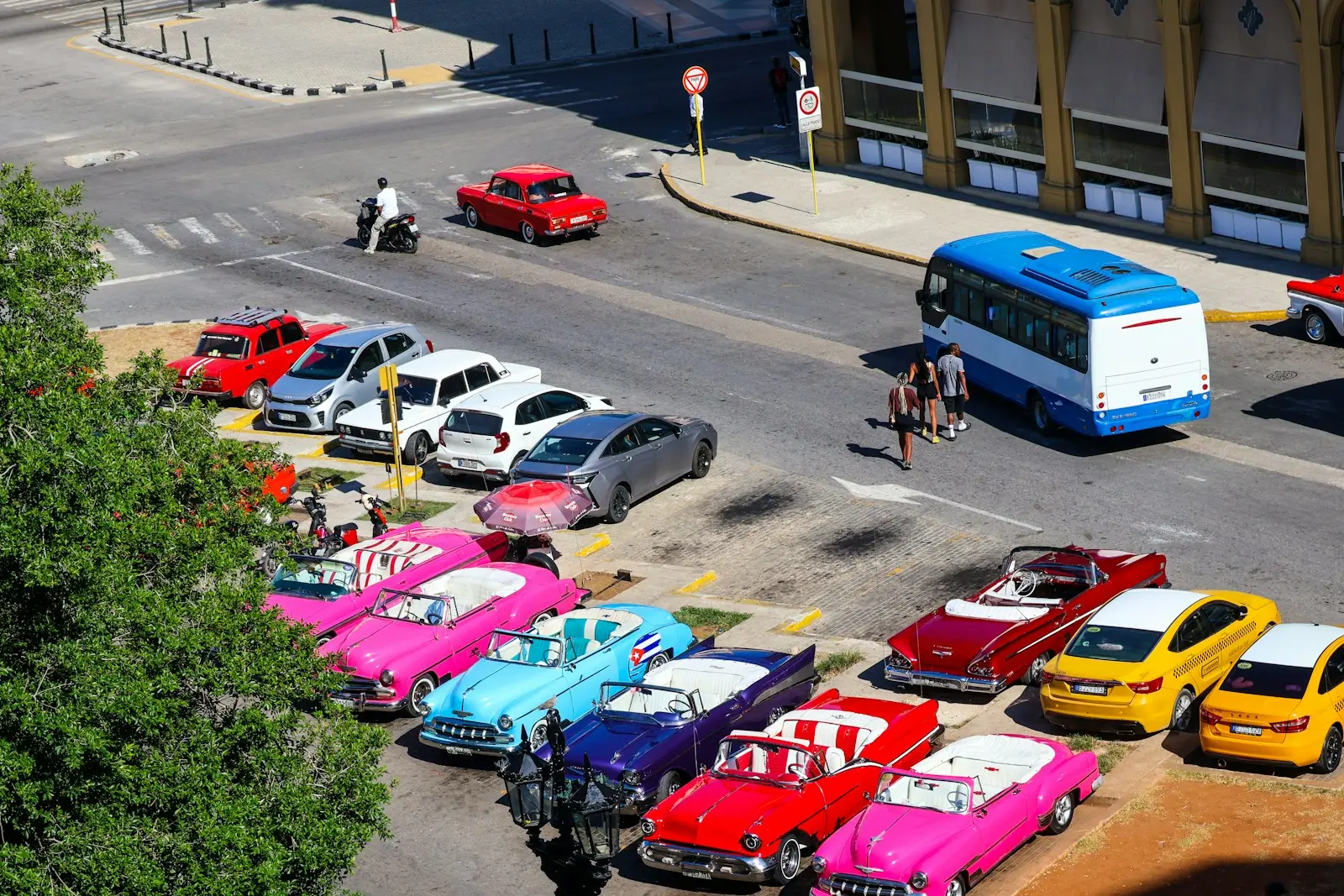 Photo by Meg von Haartman Classic cars parked on a city street.