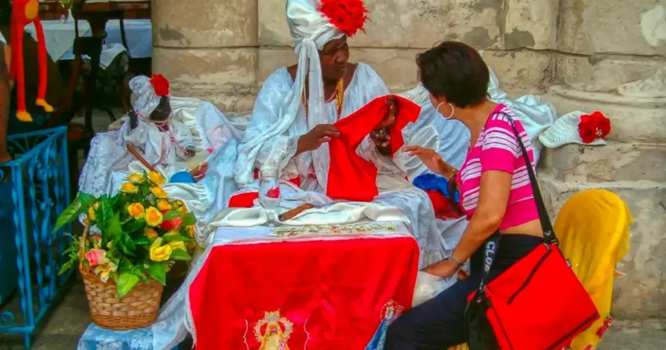 Woman interacts with vendor in traditional attire